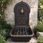 Ornate cast iron landscape wall fountain with brass tap, antique bronze finish, garden patio decor
